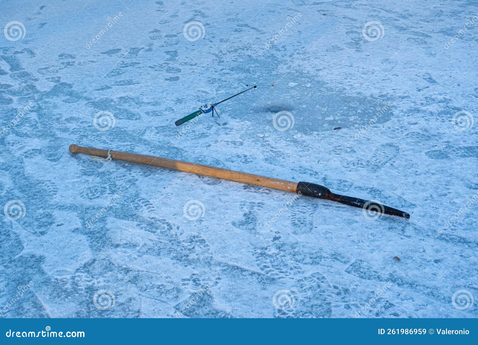 Fishing Rod Waiting for a Fish Nibble in a Frozen River Hole, Ice Auger  Lie, Human Tracks in Snow, Winter Forest Sunset, Ecology Stock Image -  Image of ecology, active: 261986959