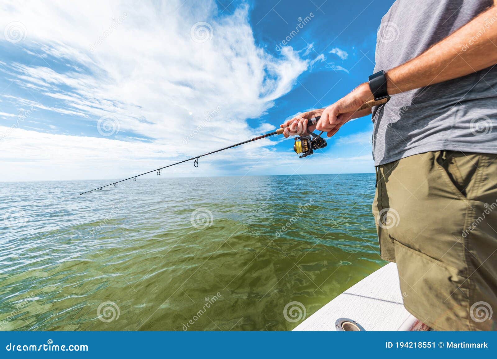 Fishing Rod Wheel Man Fishing from Fisherman Boat in Florida