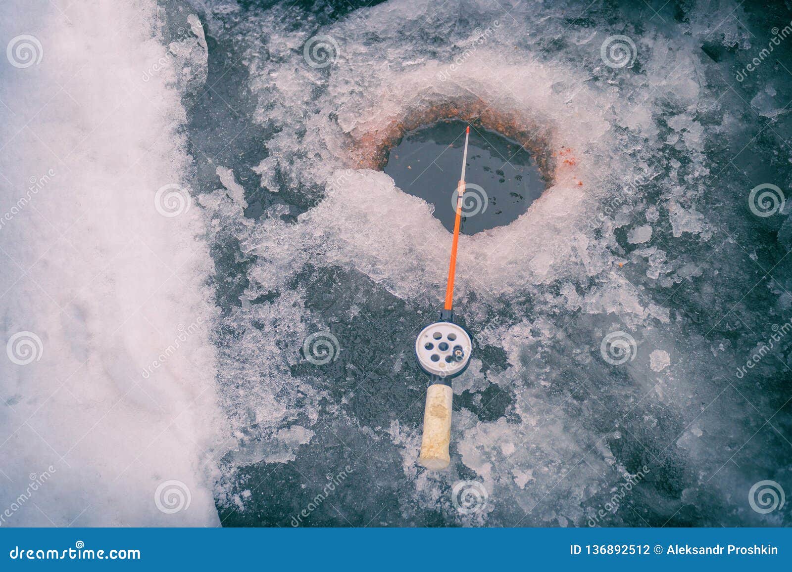 Fishing Rod for Winter Fishing and Hole in the Ice Stock Photo Image