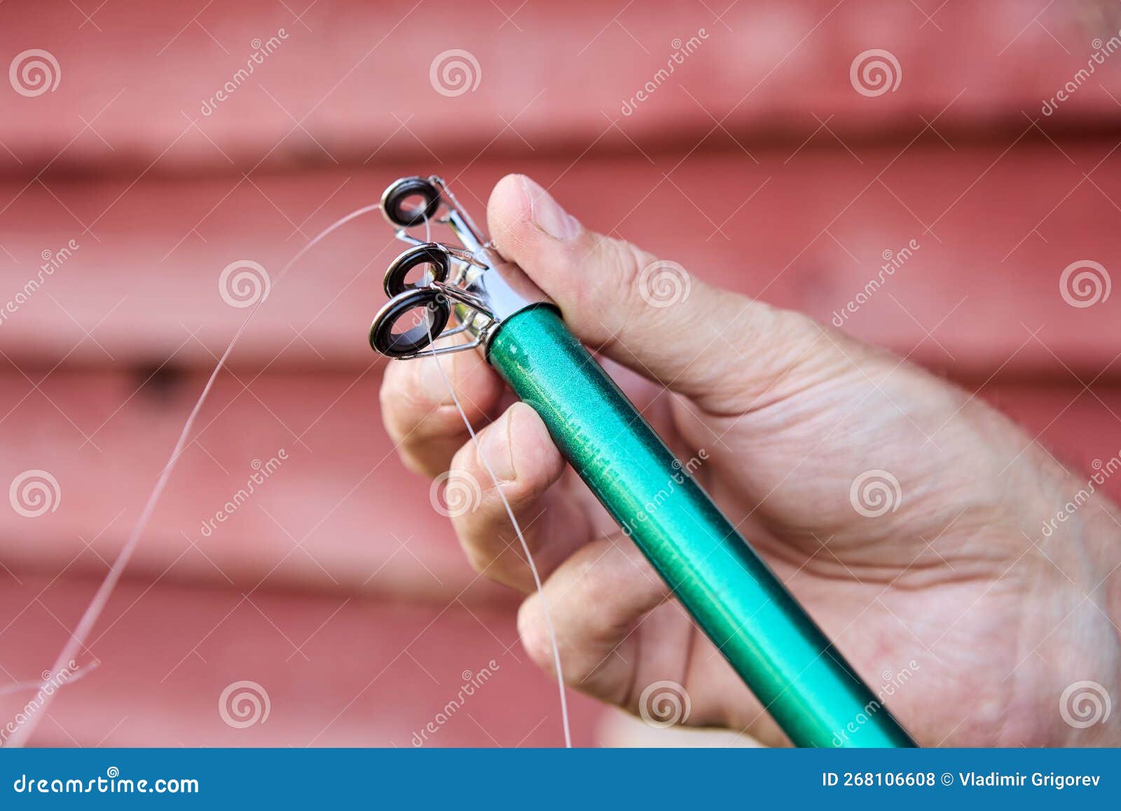 Fishing Rod Wire Ring Line Guide Attached To Rod. Stock Photo - Image of  green, hand: 268106608