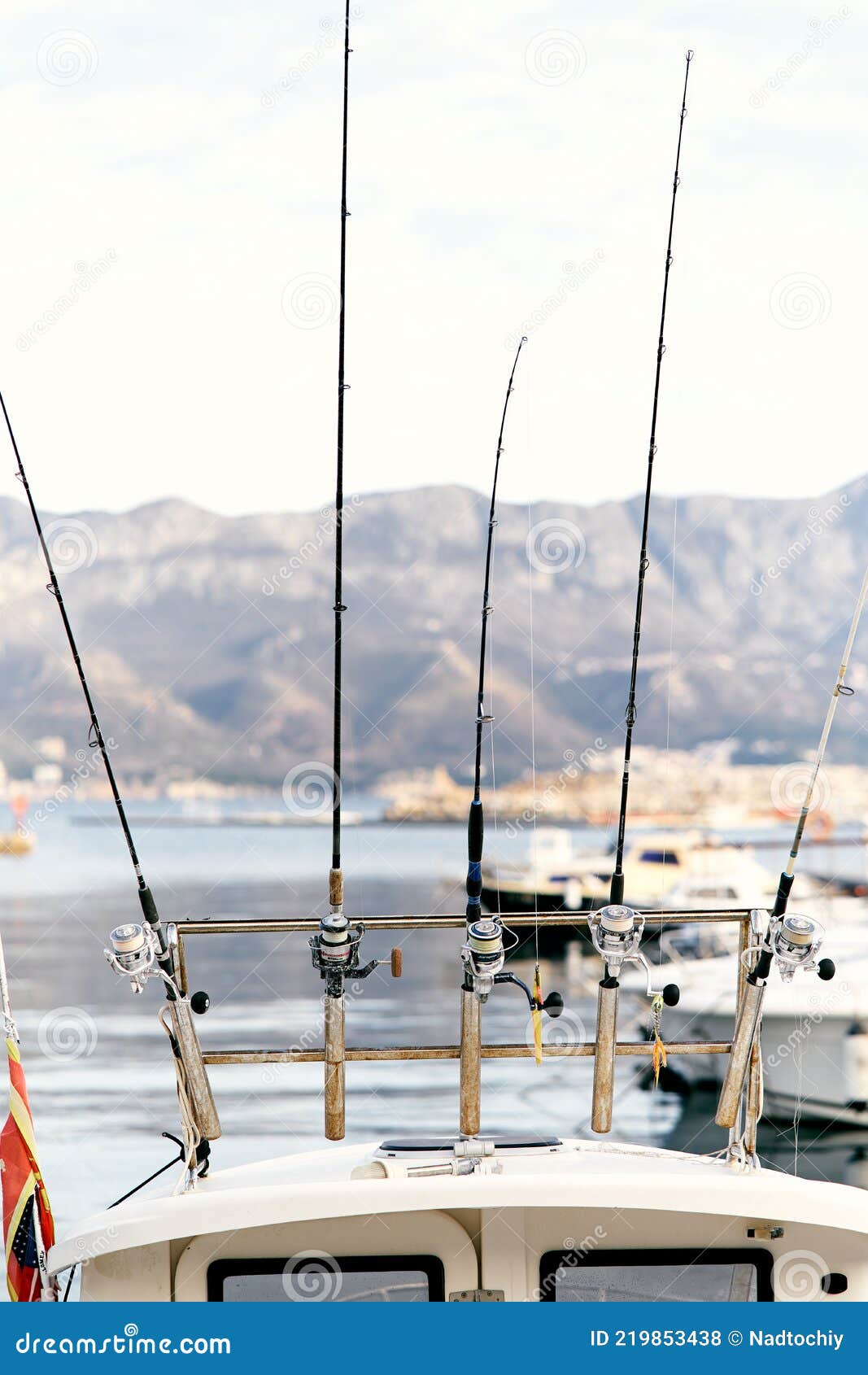 https://thumbs.dreamstime.com/z/fishing-rods-attached-to-stern-white-yacht-against-backdrop-pier-boats-sea-mountains-close-up-high-quality-219853438.jpg