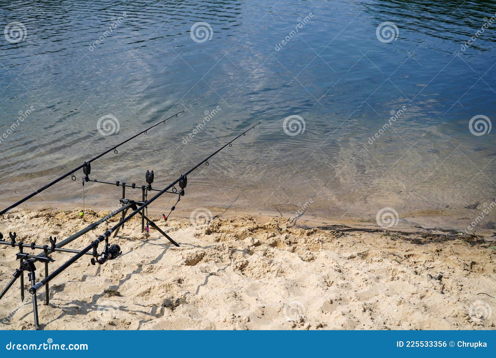 Fishing Rods on the Sandy Shore of the Lake Stock Photo Image of