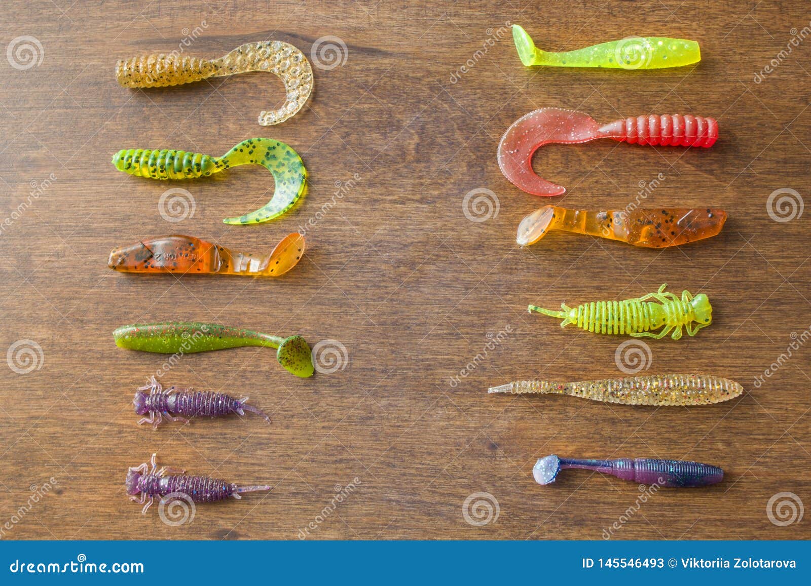 https://thumbs.dreamstime.com/z/fishing-soft-baits-wooden-background-group-isolated-silicone-lures-colourful-plastic-spinning-145546493.jpg