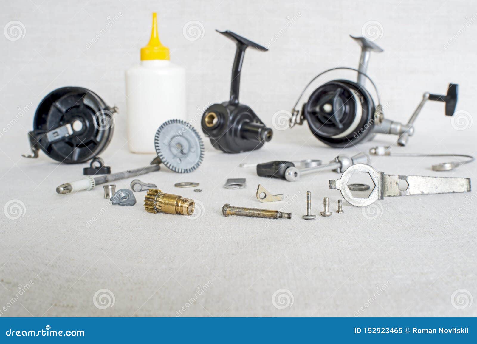 A Fishing Spinning Reel As a Whole and a Second Similar Completely  Disassembled. Concept: Parts of a Whole Stock Image - Image of design,  casting: 152923465