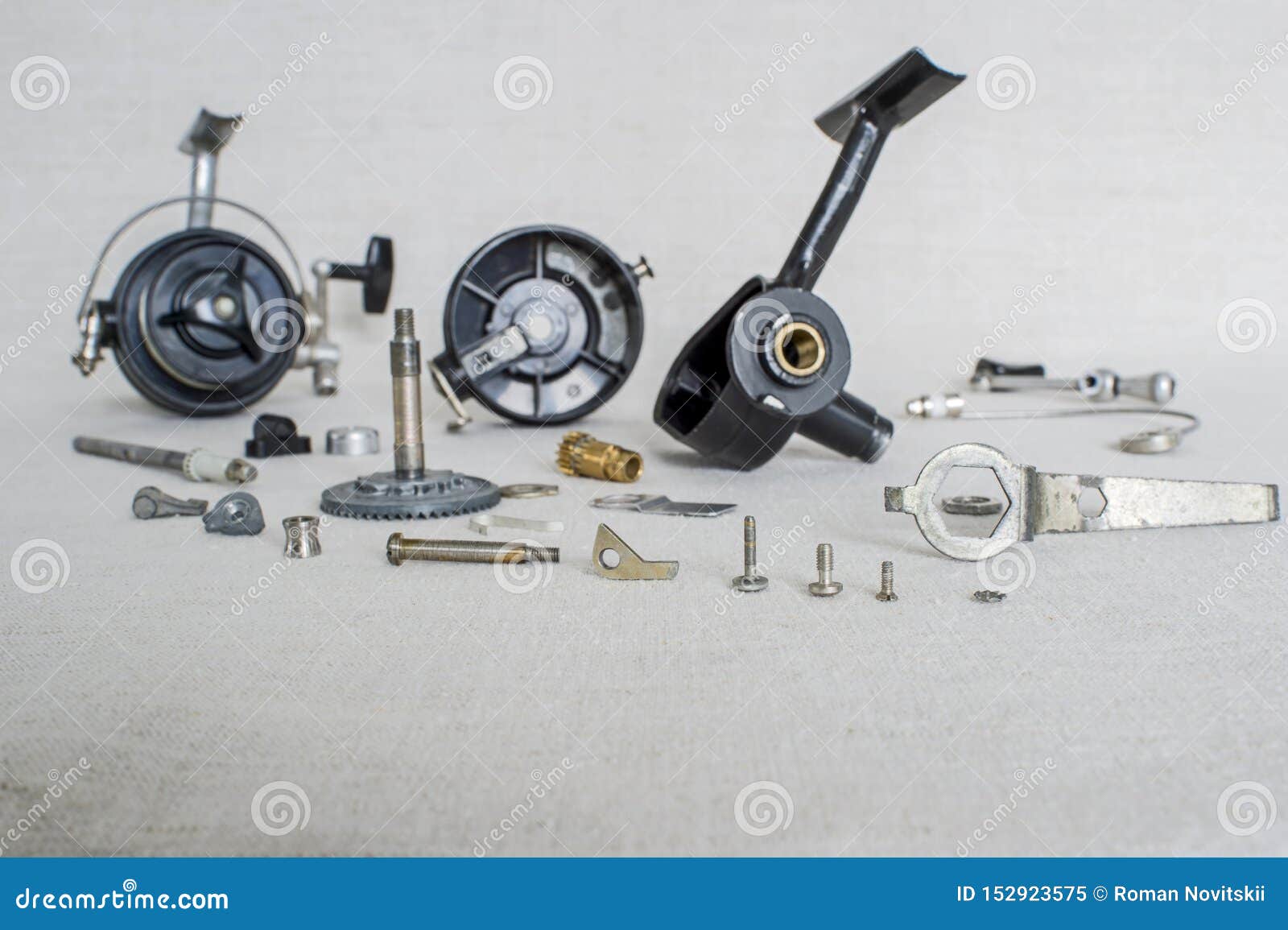A Fishing Spinning Reel As a Whole and a Second Similar Completely  Disassembled. Concept: Parts of a Whole Stock Image - Image of season,  design: 152923575