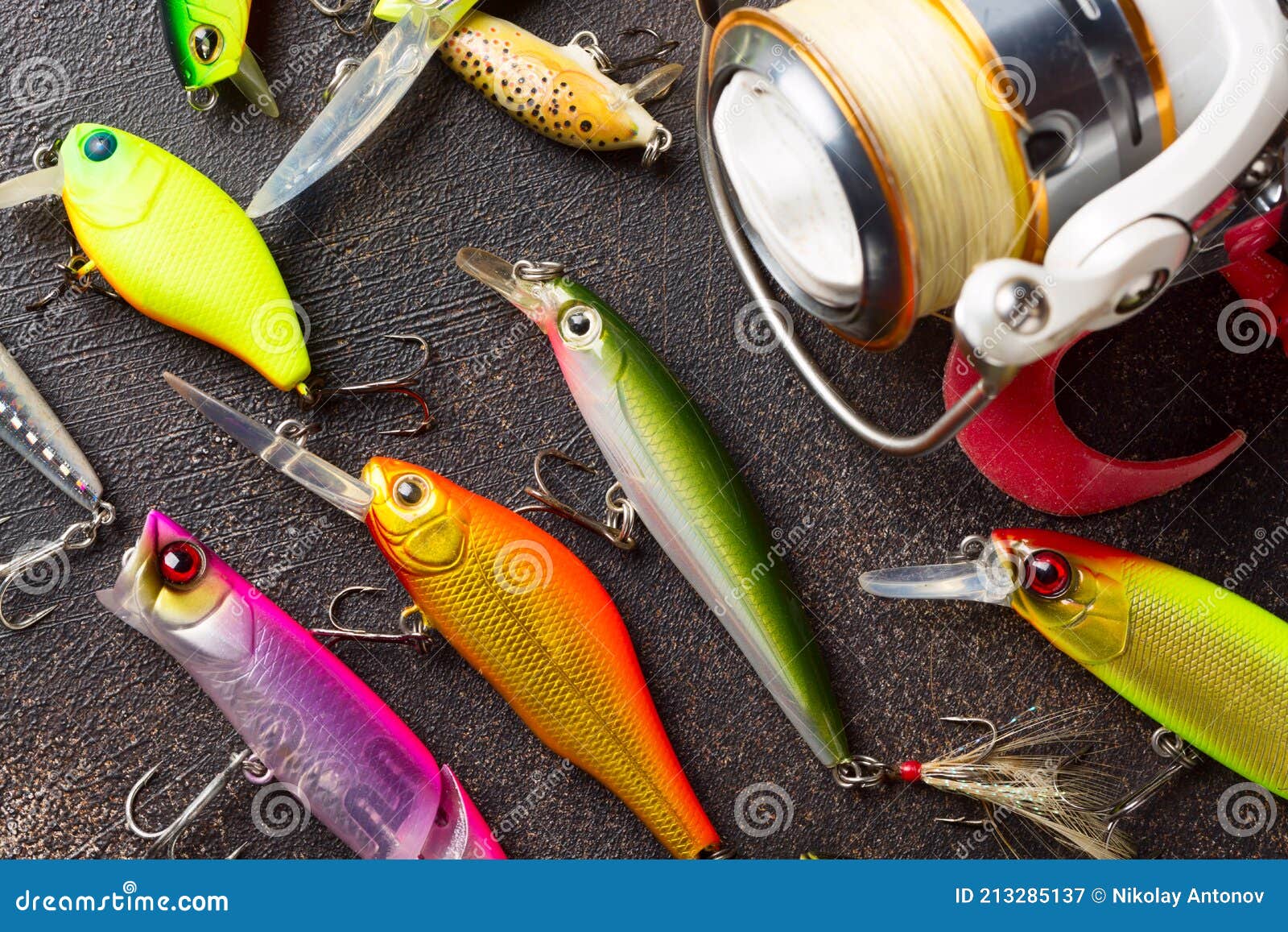 Fishing Spinning Reel and Wobblers. Fishing Background Stock Image - Image  of bait, metal: 213285137