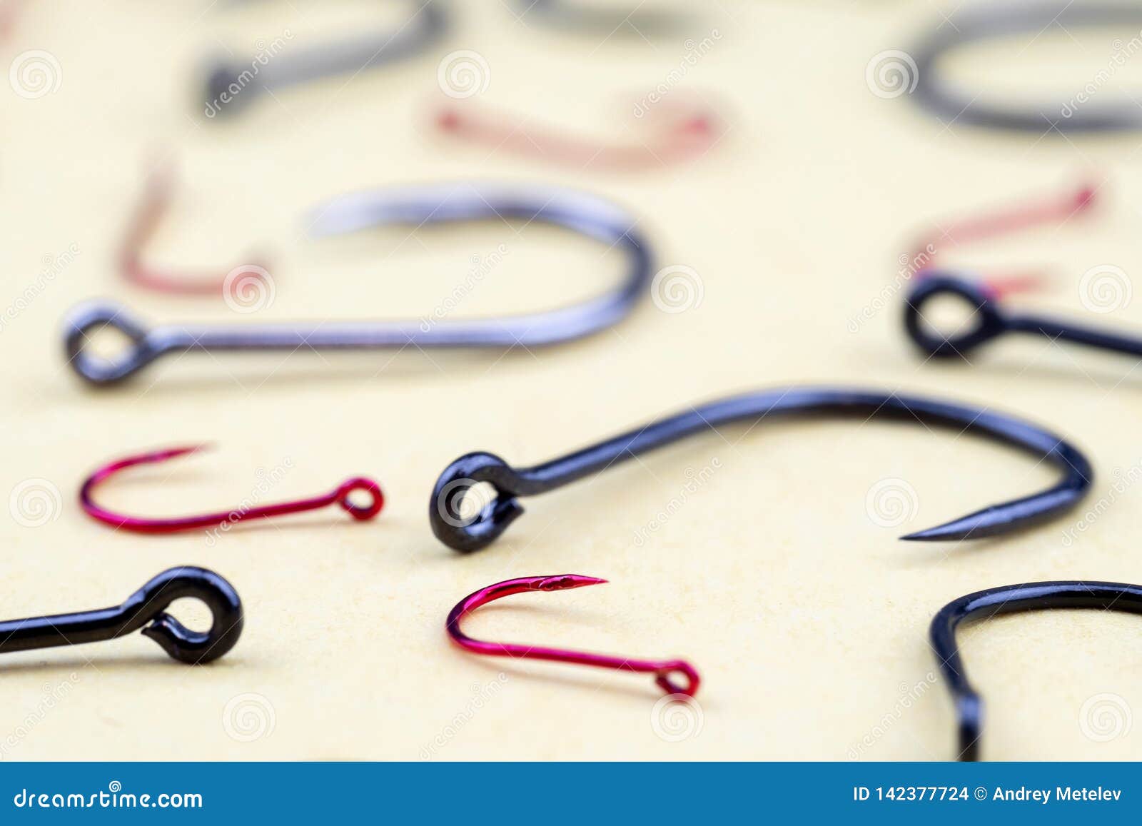 Fishing Tackle Fishing Hooks in Large Quantity on Yellow Surface Stock