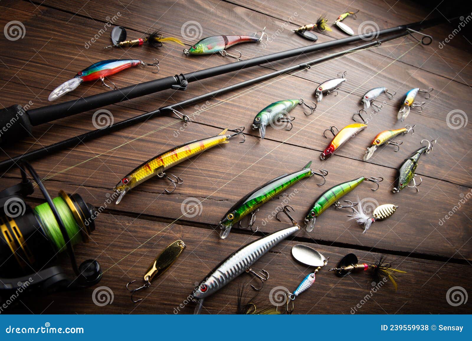 Fishing Tackle - Fishing Spinning Rod, Hooks and Lures on Wooden