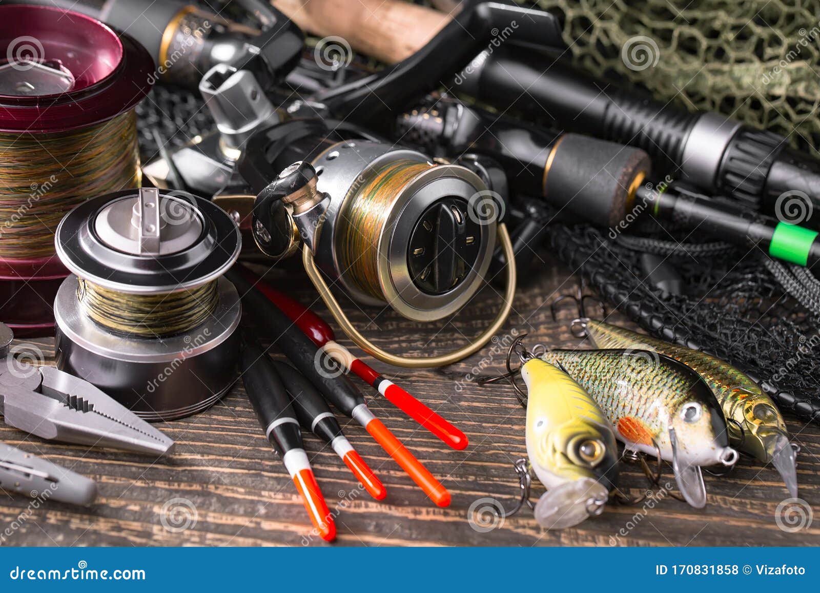 https://thumbs.dreamstime.com/z/fishing-tackle-wooden-table-fishing-rods-spinnings-composition-accessories-fishing-old-background-170831858.jpg