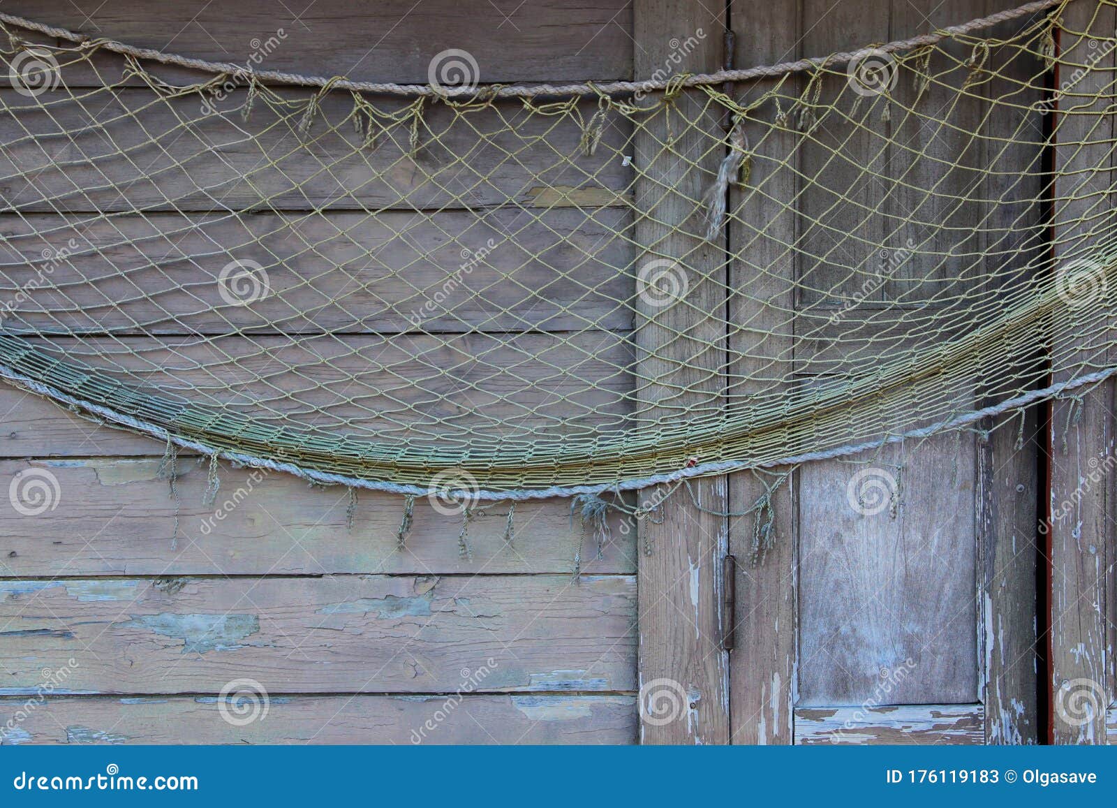 https://thumbs.dreamstime.com/z/fishnet-hanging-wooden-wall-abstract-sea-life-background-fishing-net-over-closed-storm-window-176119183.jpg