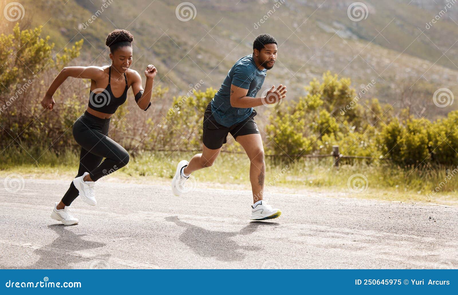 Jogging couple. African american persons man and woman running