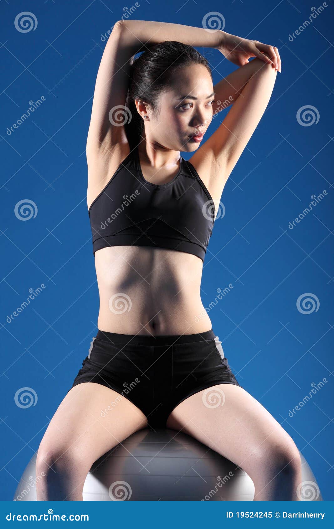 Beautiful healthy happy smiling black asian woman with dumbbell