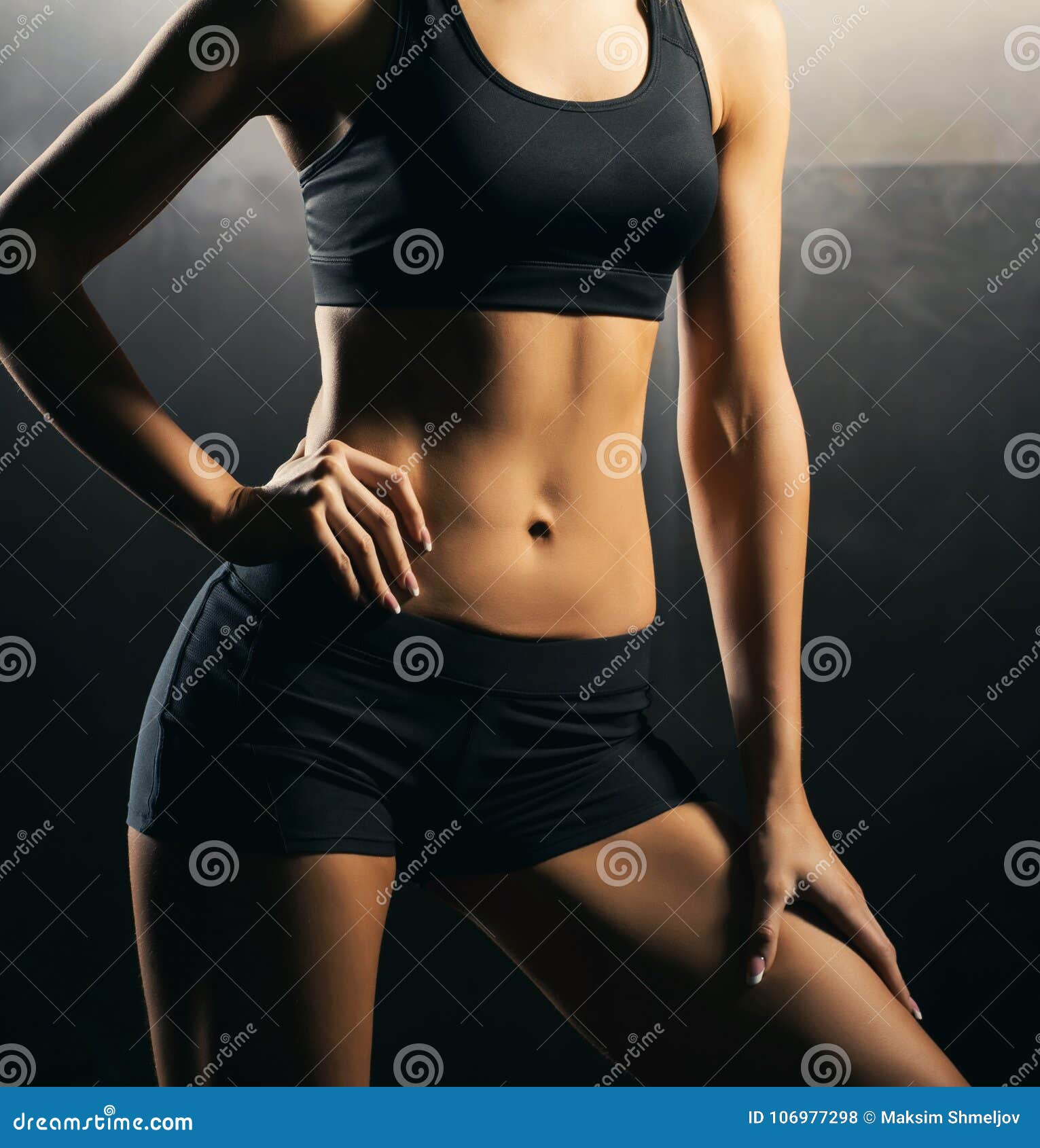 Free Photo  Cropped close up body of fit woman wearing shorts and sport  top showing slim beautiful stomach and abs