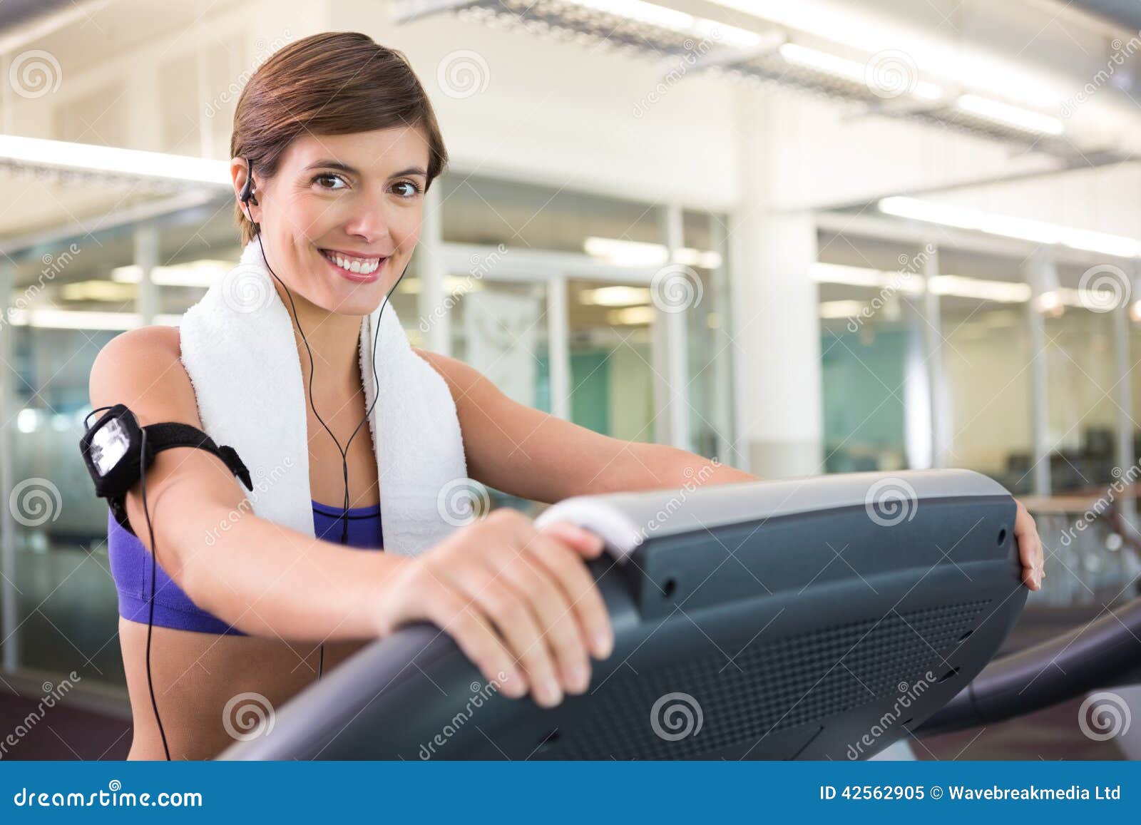 Fit Brunette Running on the Treadmill Listening To Music Stock Image ...