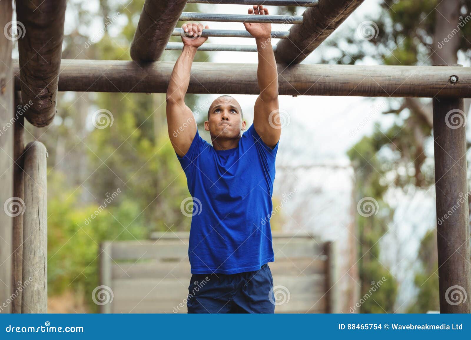 Fit Man Climbing Monkey Bars Stock Photo Image of athletic, hanging 88465754