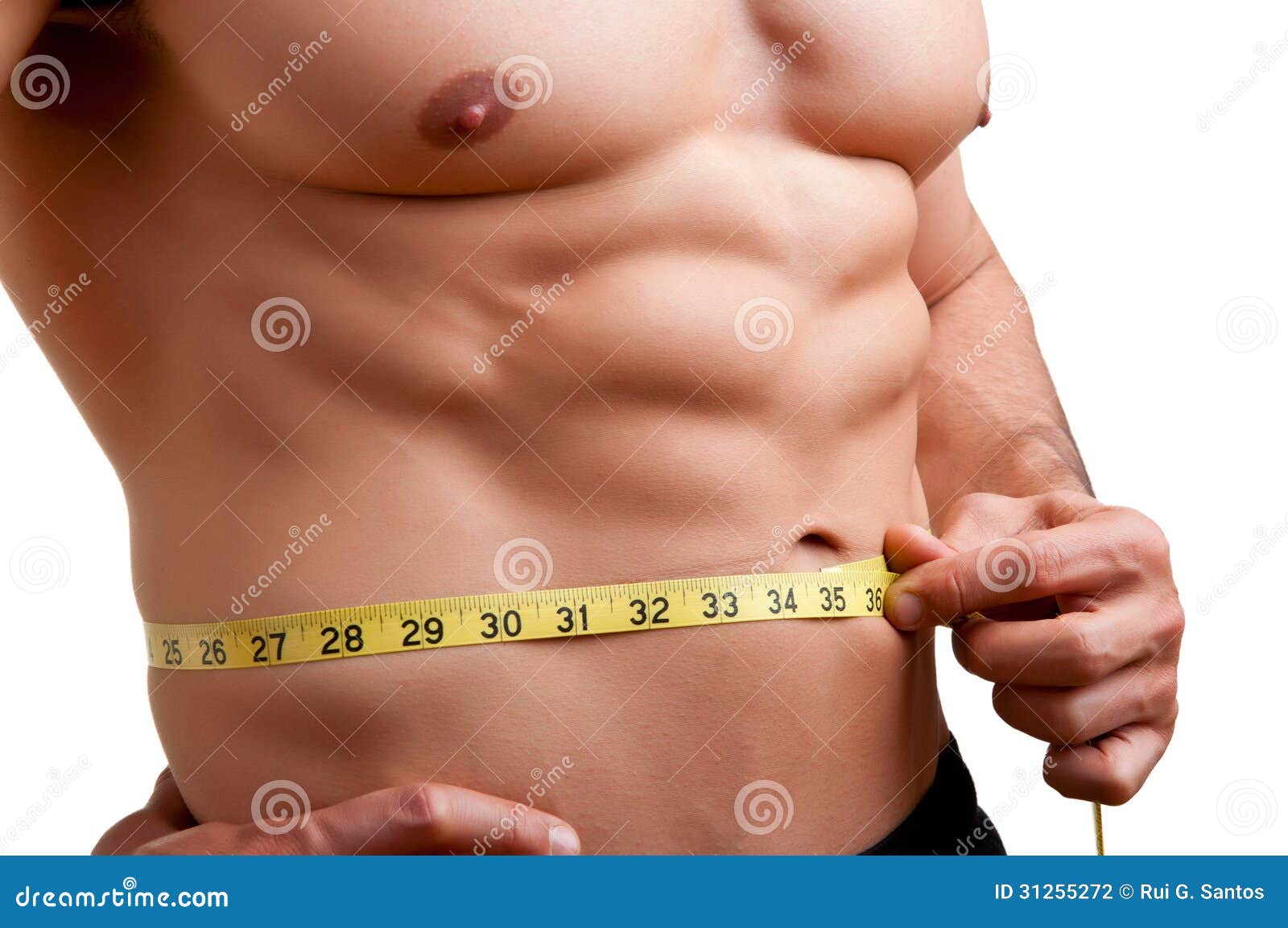 fit man measuring his waist