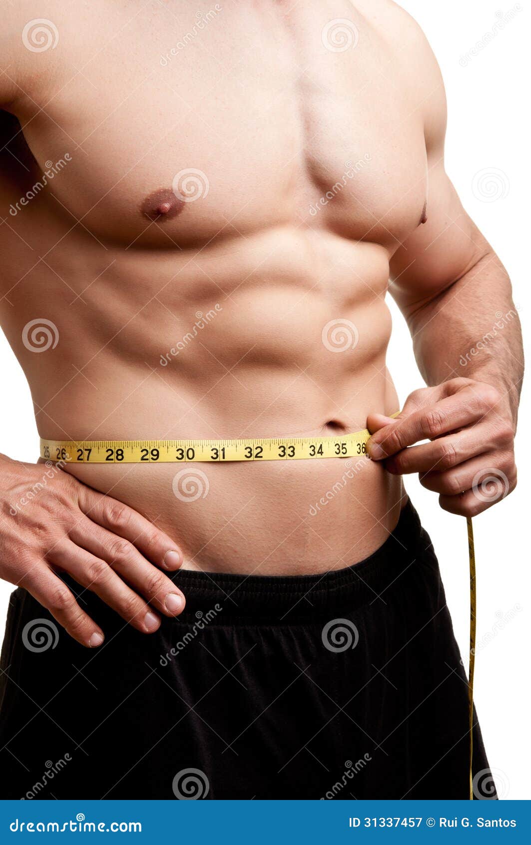 fit man measuring his waist