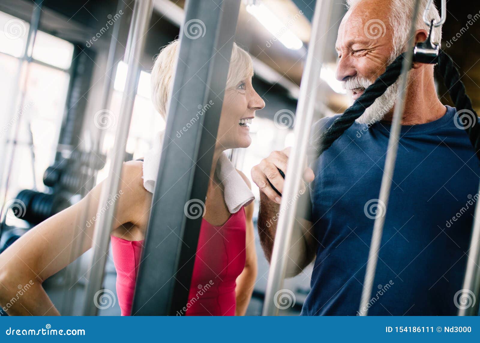 Fit Senior Sporty Couple Working Out Together At Gym Stock Image