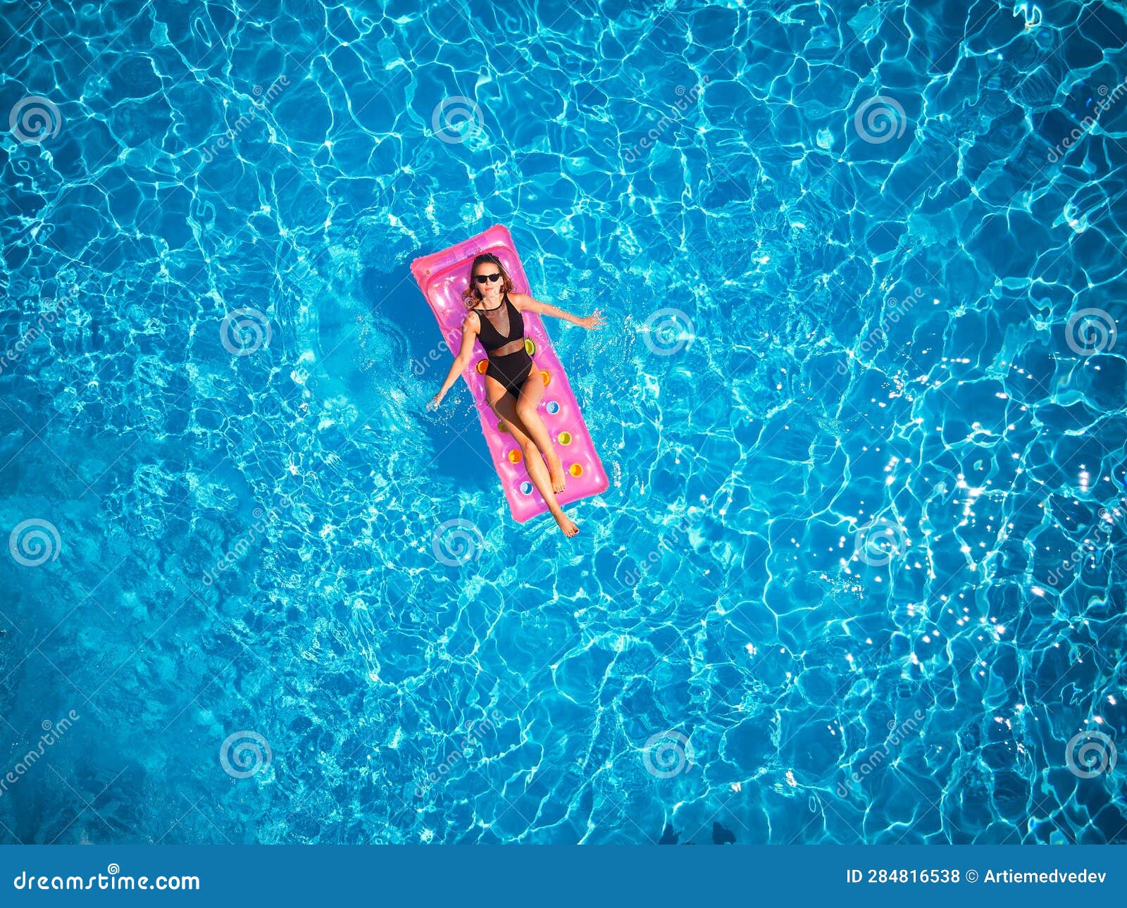 Fit Pretty Girl in Bikini Chilling on Inflatable Pink Mattress in ...