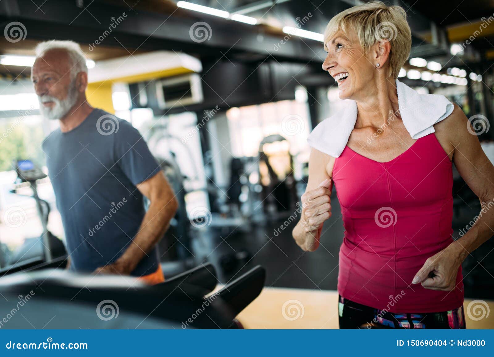 Fit Senior Sporty Couple Working Out Together At Gym Stock Photo