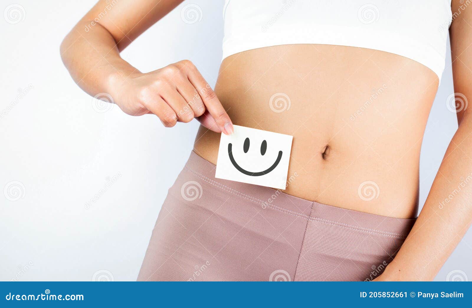 Fit Slim Body Holding White Card With Happy .Smiley Face In Hands Good Digestion Concepts