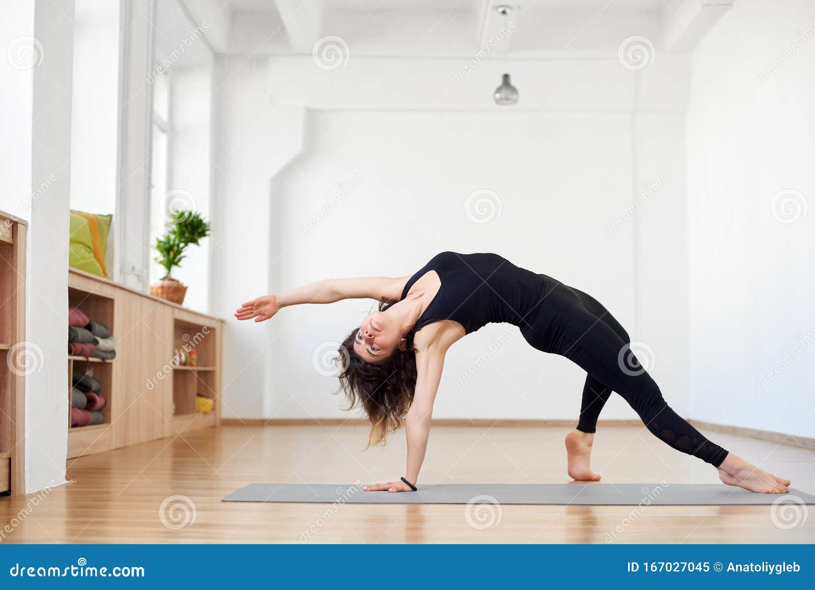 Fit Sporty Flexible Girl Doing Backbend Stretching Exercise. Camatkarasana  Wild Thing or Flip-the-Dog Pose. Copy Space Stock Image - Image of  background, fitness: 167027045
