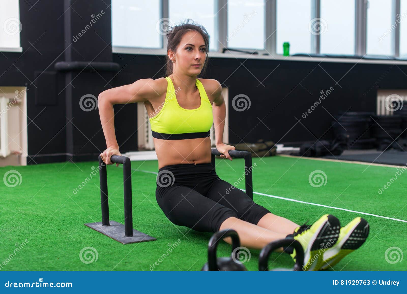 Fit Strong Woman Doing L-sits Work-out in Gym, Lifting Up Her Legs, Using  Parallel Bars Stock Image - Image of muscle, effort: 81929763