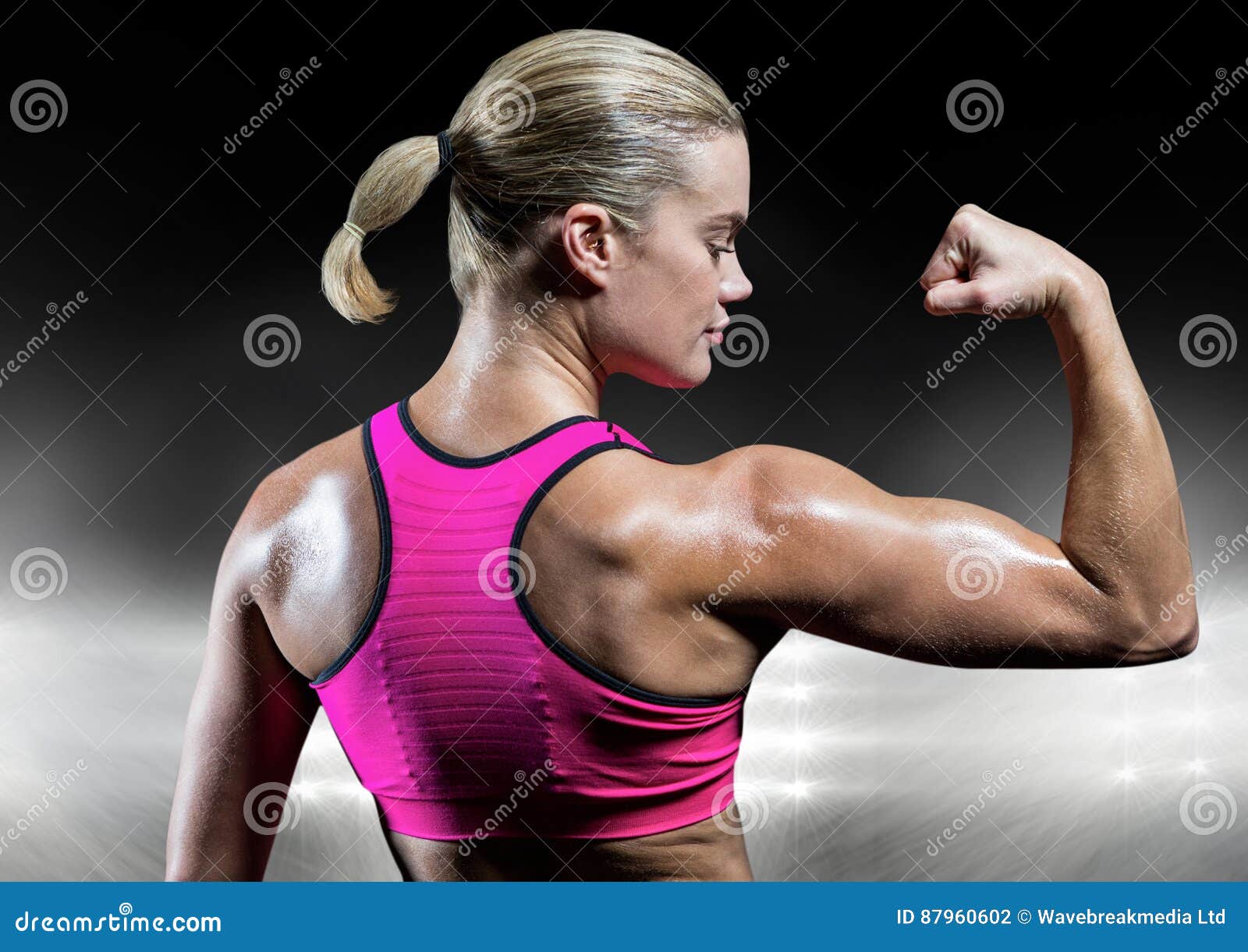 Confident Sporty Woman Flexing Muscles On Beach. Beautiful Young