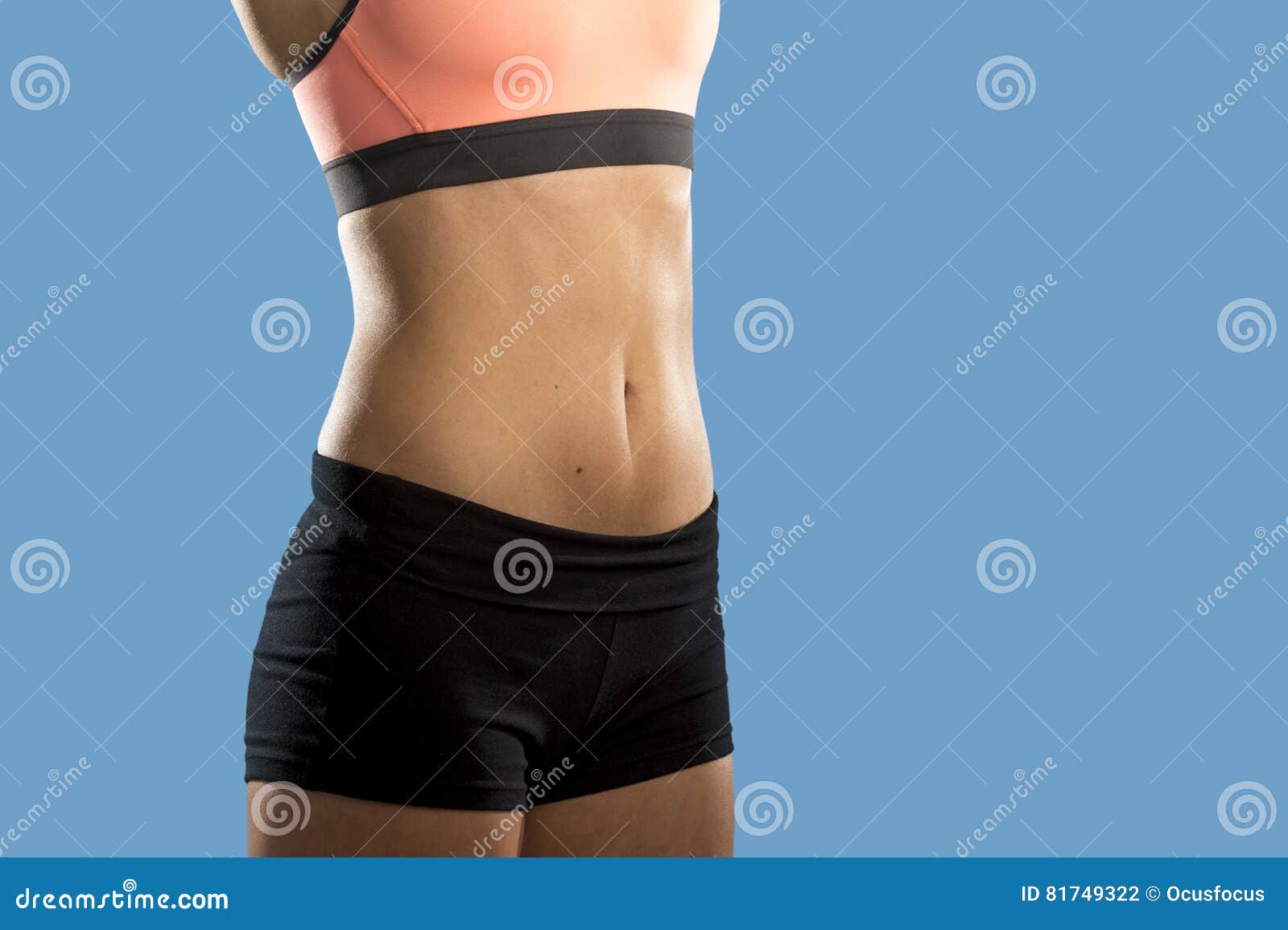 Free Photo  Cropped close up body of fit woman wearing shorts and sport  top showing slim beautiful stomach and abs