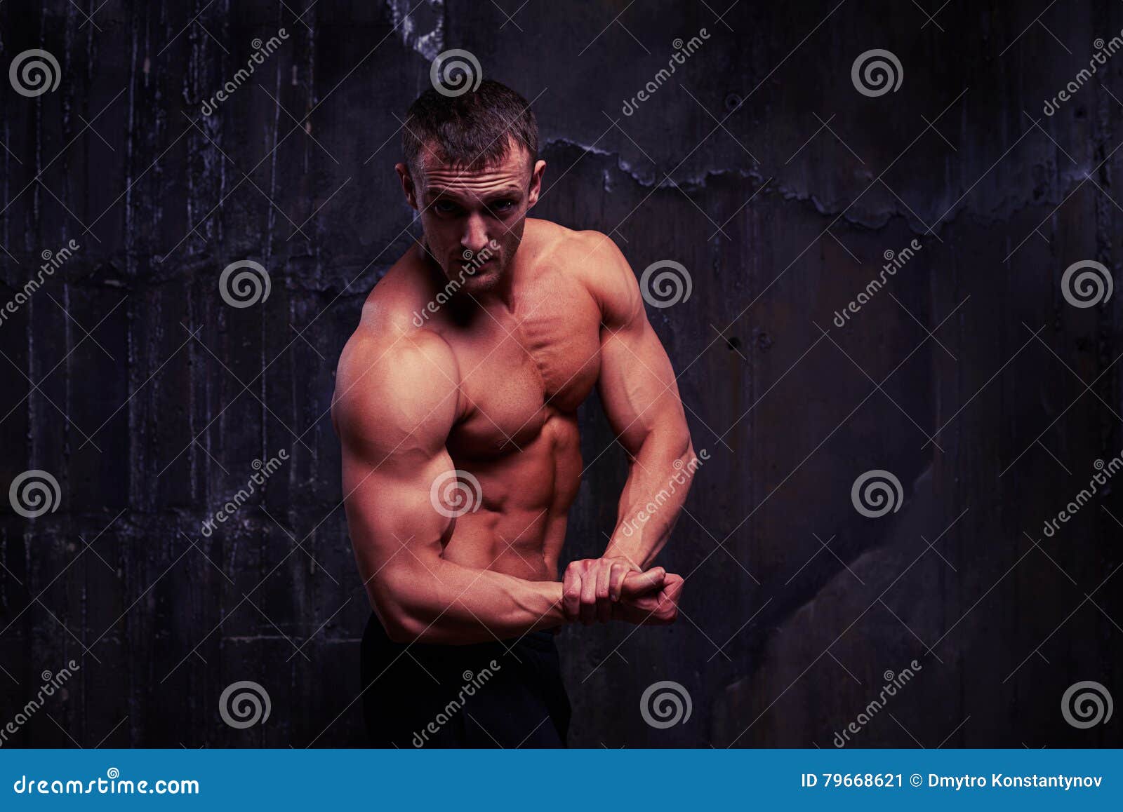 Fit Young Athlete Showing His Well-trained Biceps and Triceps Stock ...