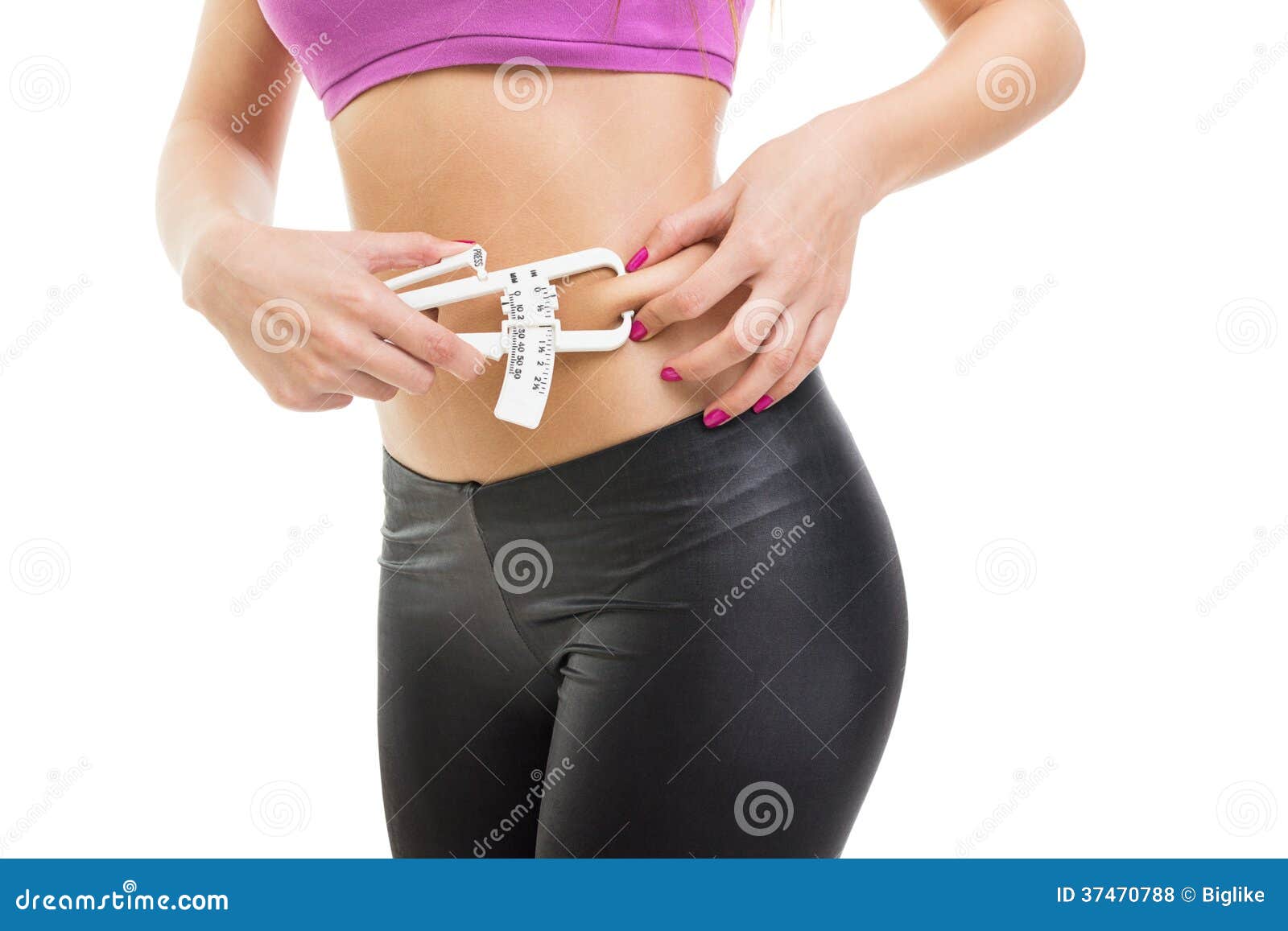 Fit Young Woman Measuring Fat On Waist Using Caliper 