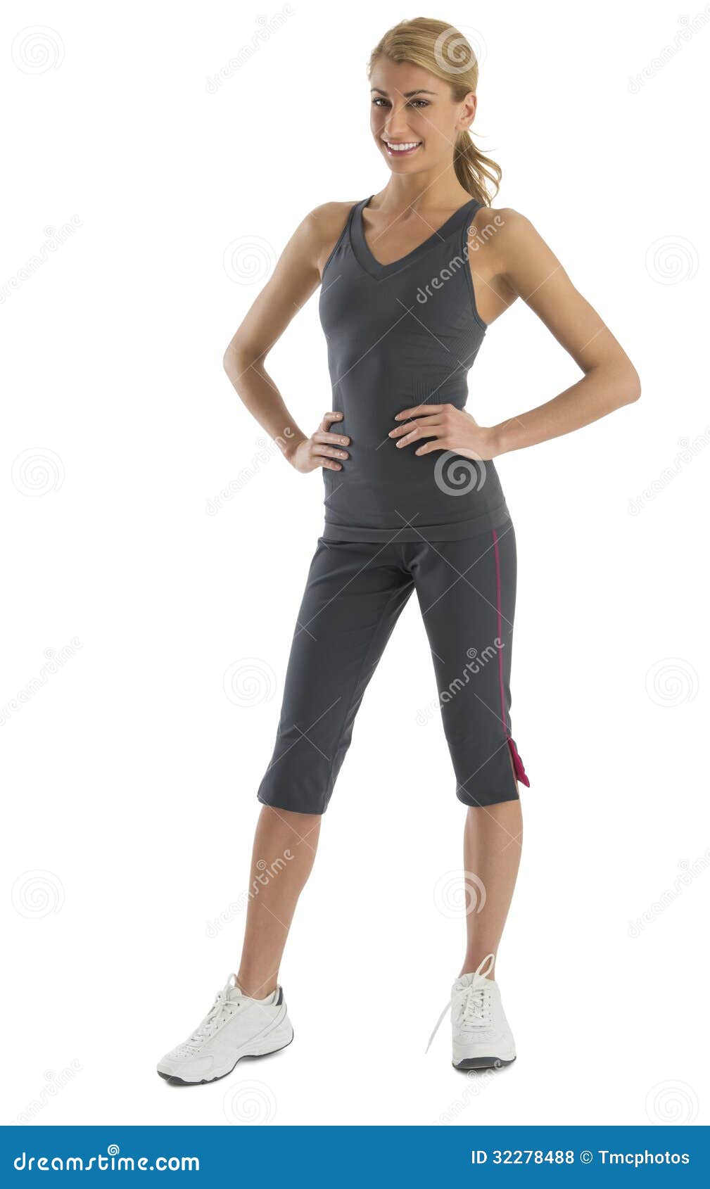 Fit Young Woman in Sports Clothing with Hands on Hips Stock Photo ...