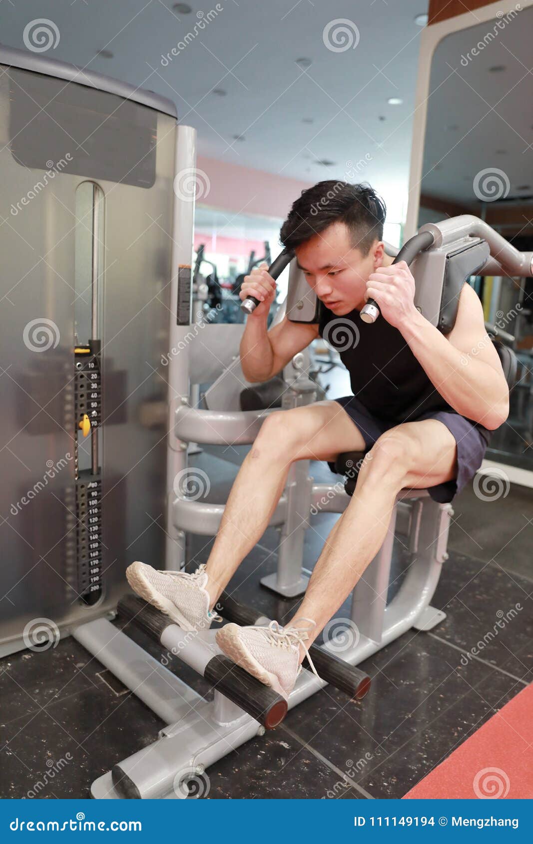 In Fitness Center Man Working. Slim Man Sitting and Hard Working on Sport  Equipment , Male Doing Push Ups in Gym Stock Photo - Image of center,  condition: 111149194