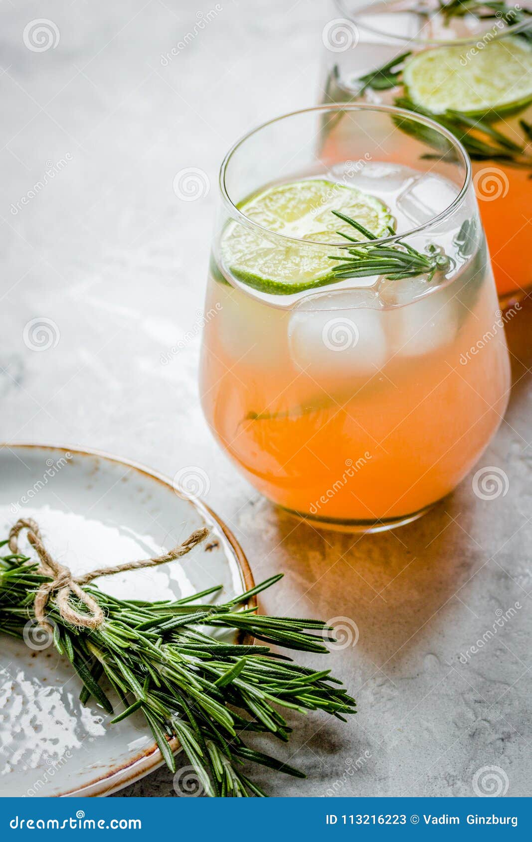 Fitness Cocktail in Glass with Lime and Rosemary on Stone Table Stock ...