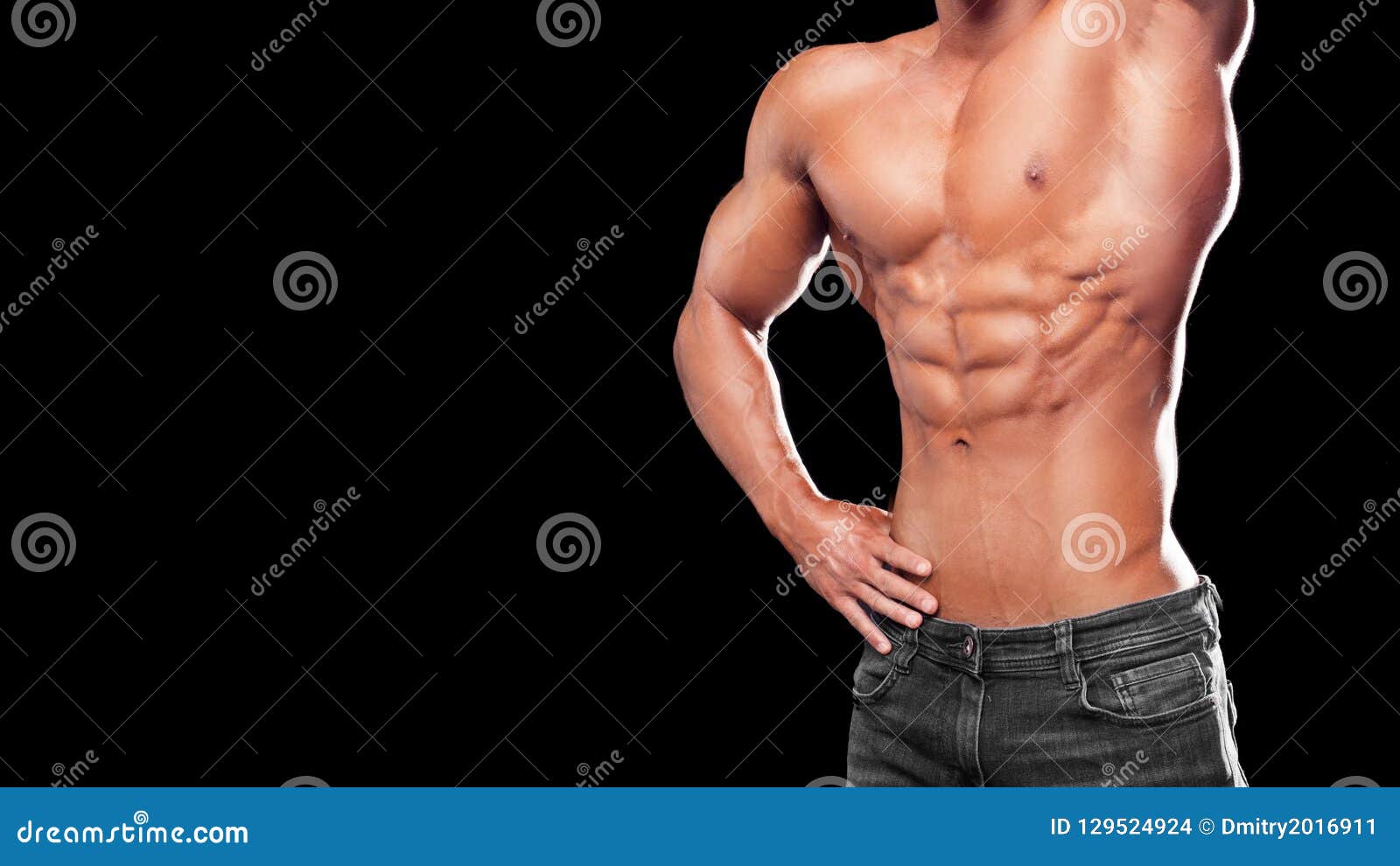 Muscular young man with perfect Torso with six pack abs 