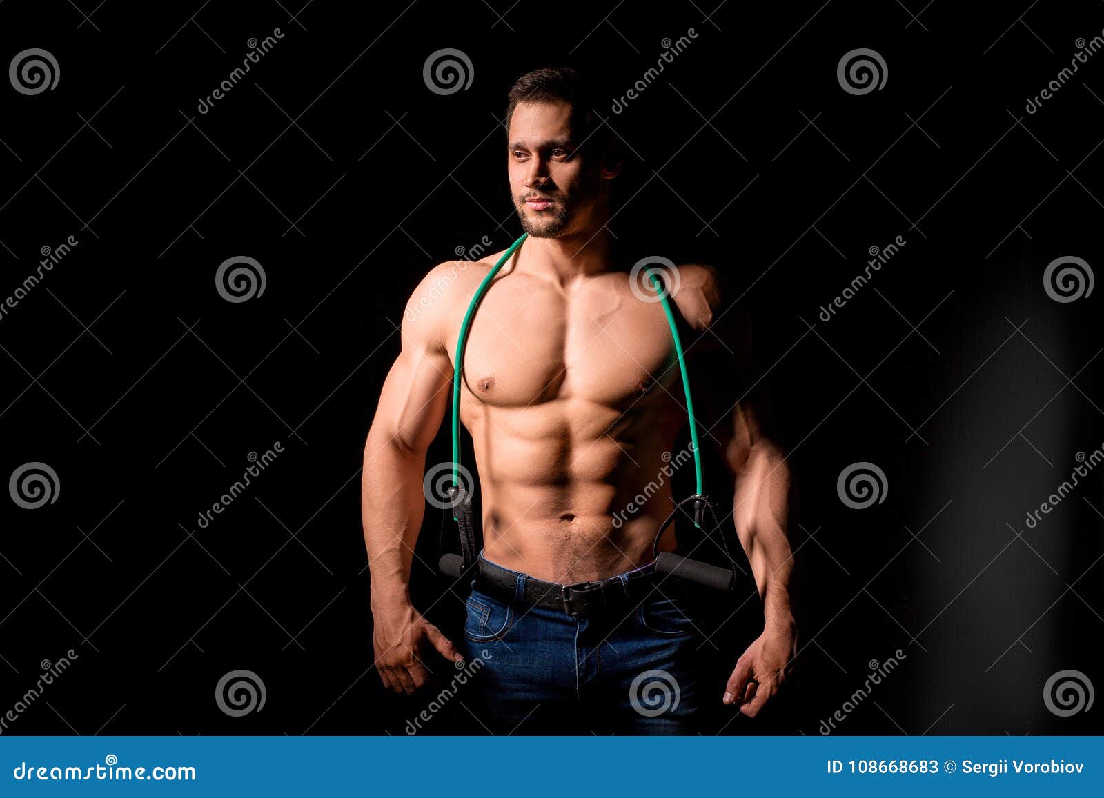 Muscular young man with perfect Torso with six pack abs 