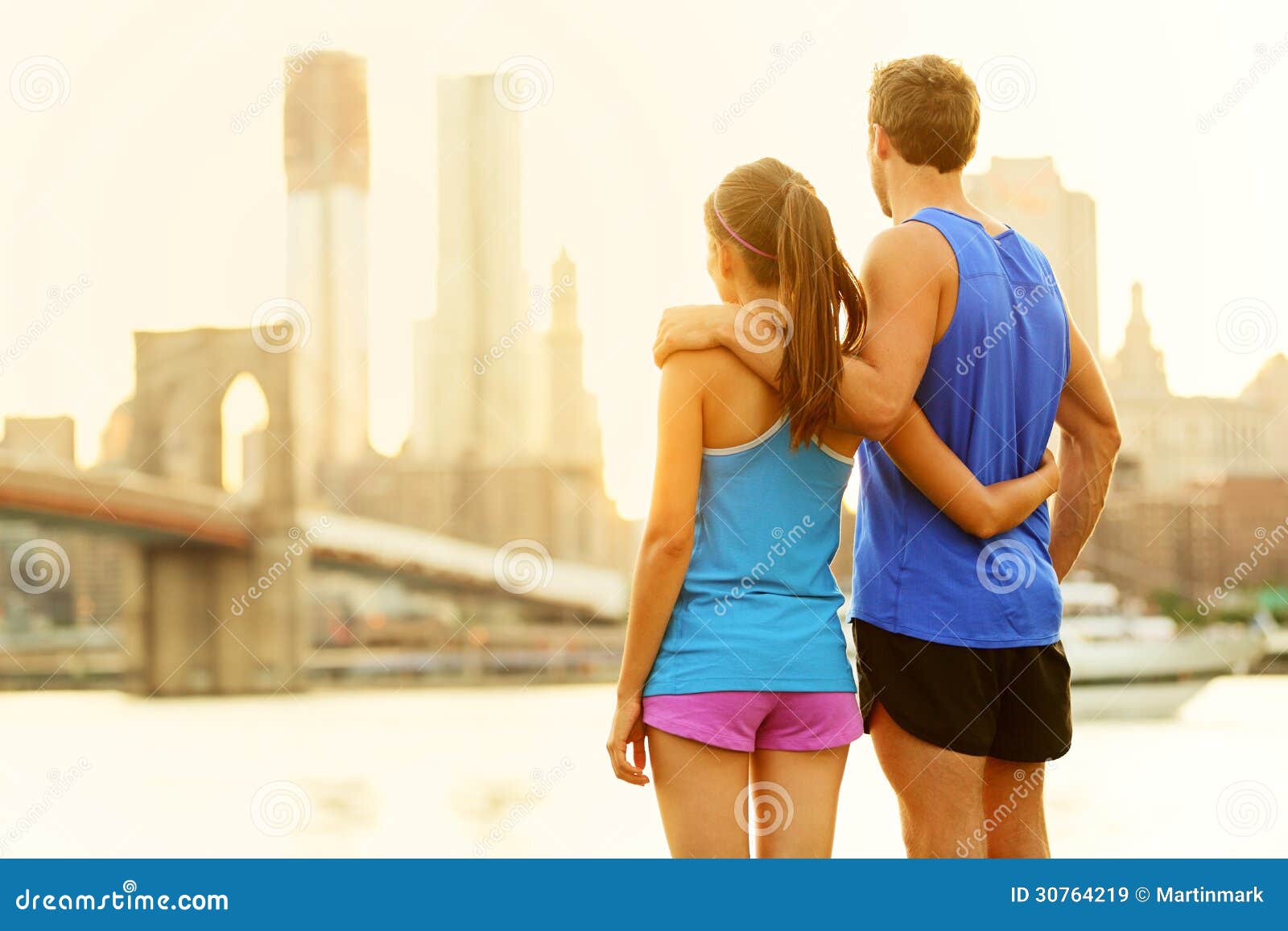 Smiling Young Couple Training Outside Together · Free Stock Photo