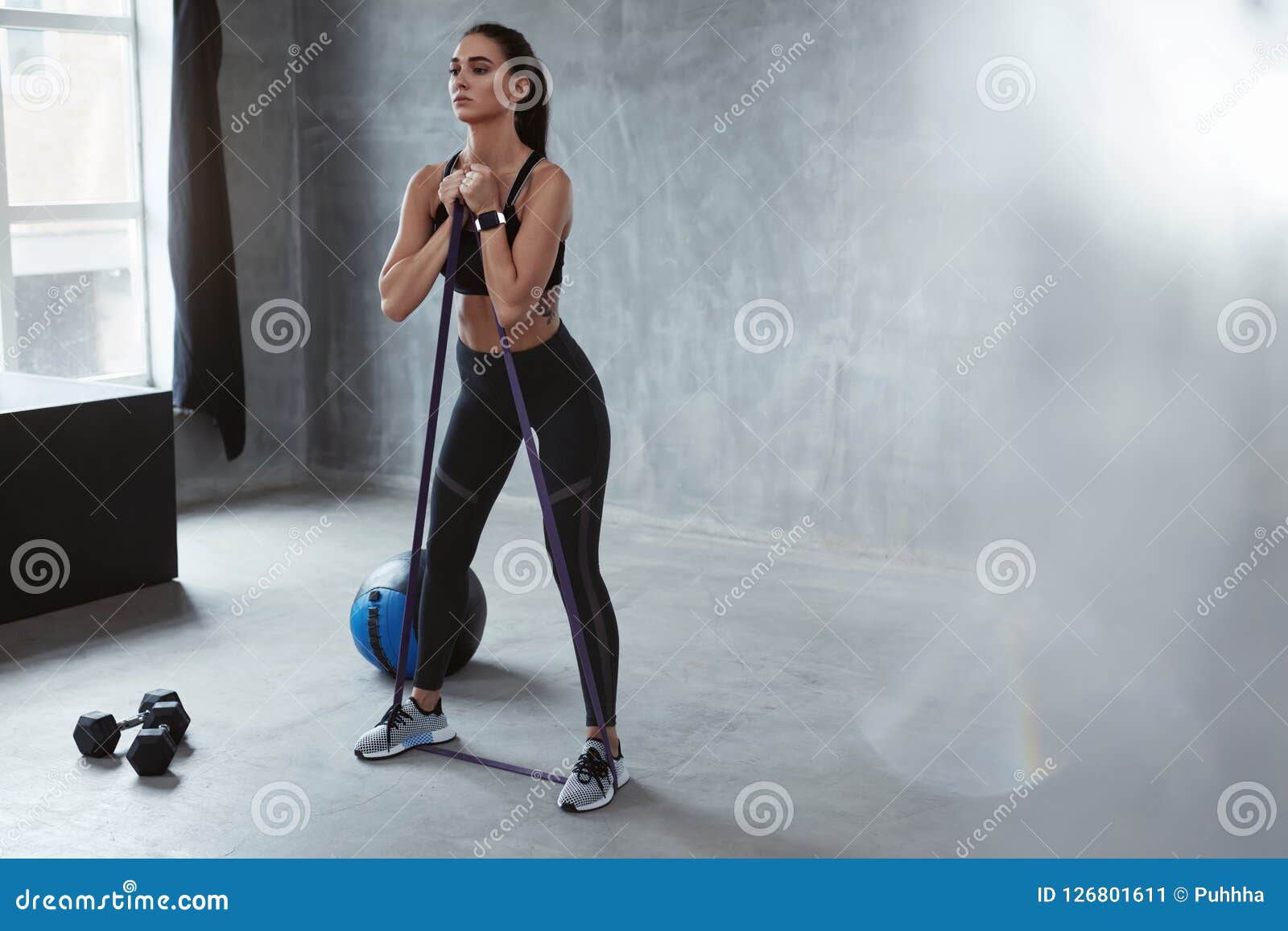 fitness exercise. sports woman exercising with resistance band