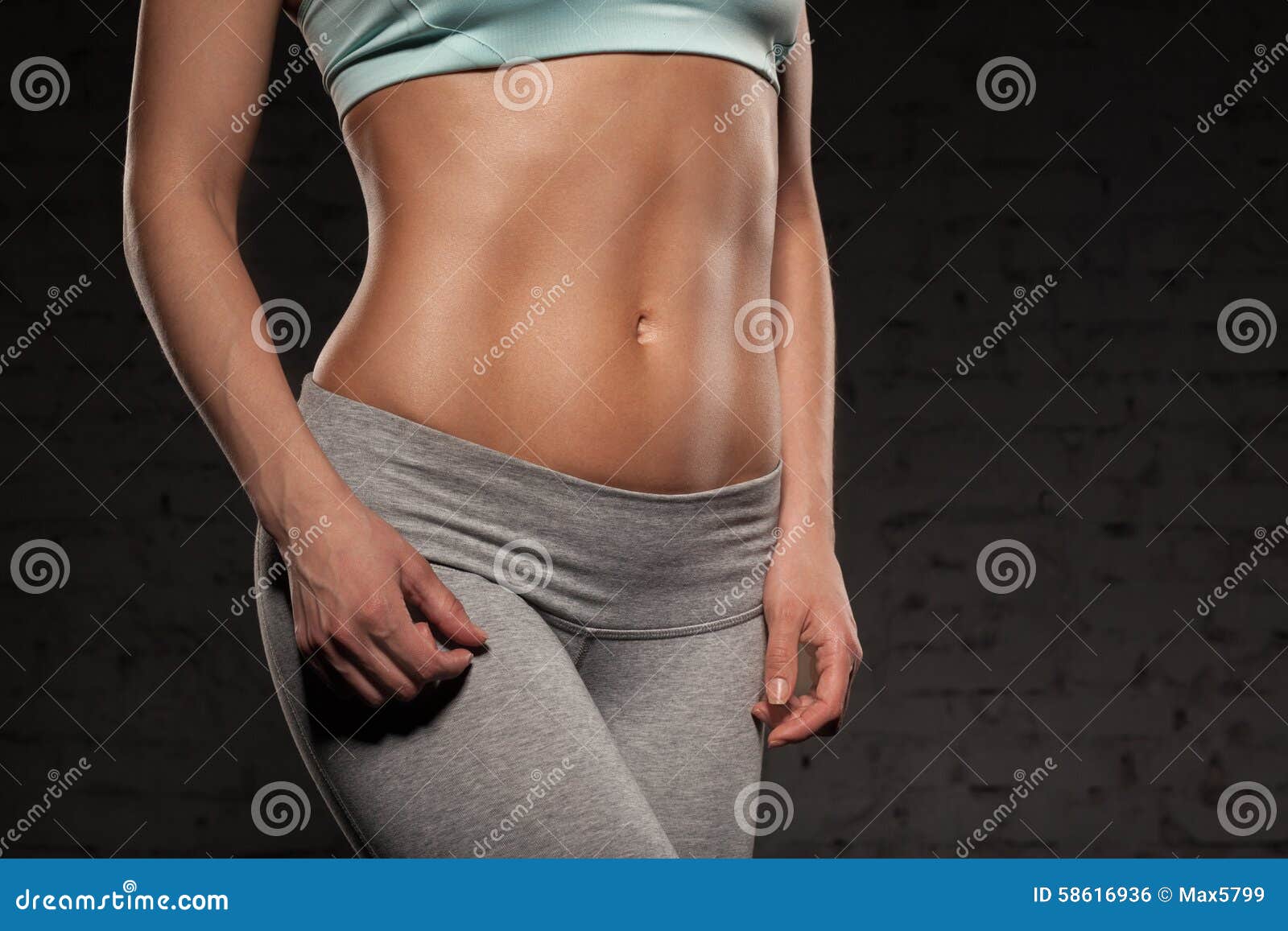 fitness female woman with muscular body, do her workout, abs, abdominals