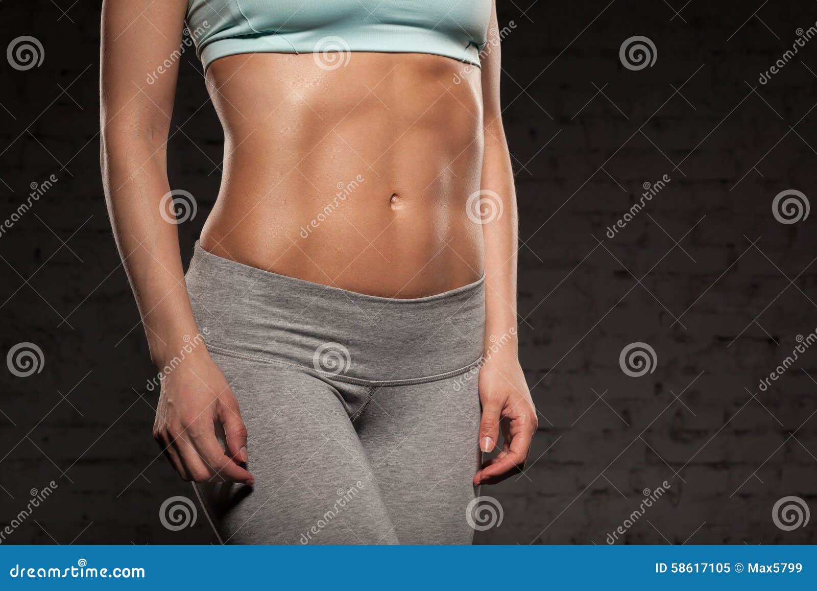 fitness female woman with muscular body, do her workout, abs, abdominals