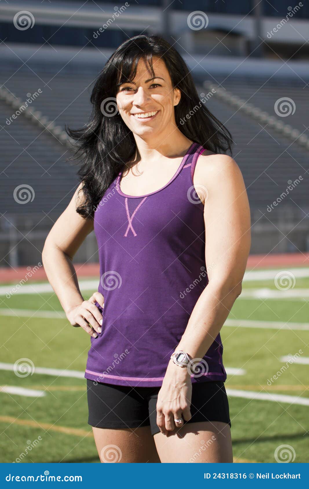 Fitness Girl on Field. Beautiful Fitness Girl on Football Field