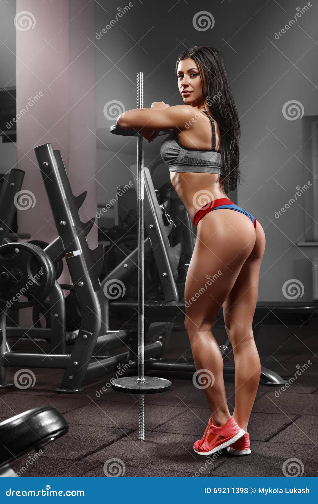 Fitness woman workout in gym. Active girl with shaped glutes. Beautiful  buttocks in thong Stock Photo