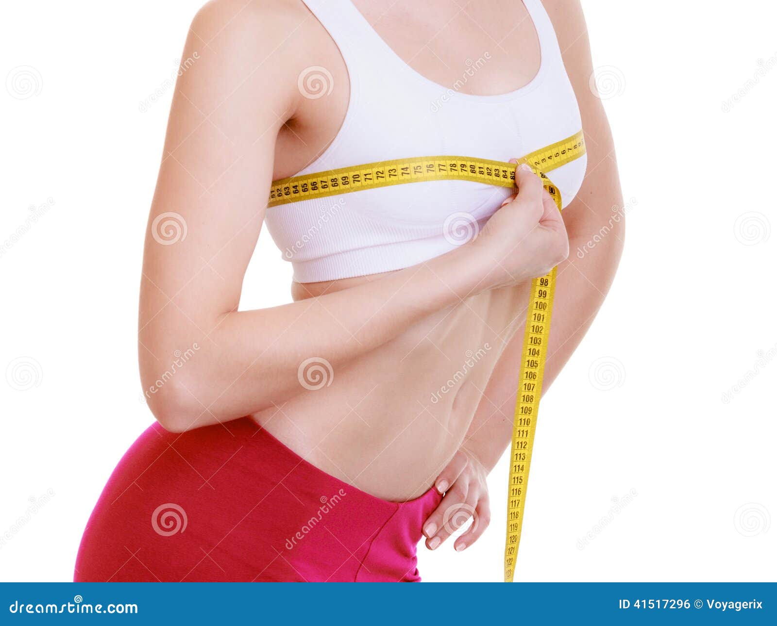 Foto de Woman using a tape measure to make bust measurement in inches do  Stock