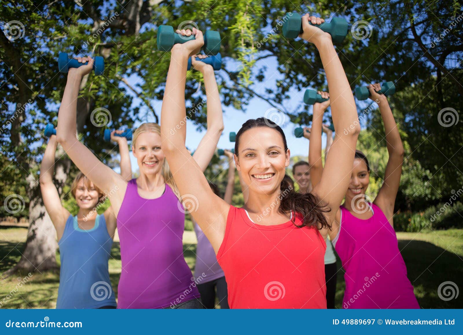 Fitness Group Lifting Hand Weights in Park Stock Image Image of