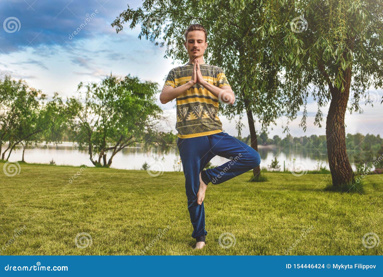 Fitness Man Doing Exercise on One Leg in the Park. Enjoying Nature ...