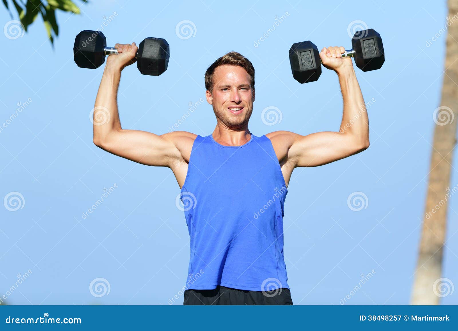 Bicep curl free weights training fitness man outside working out