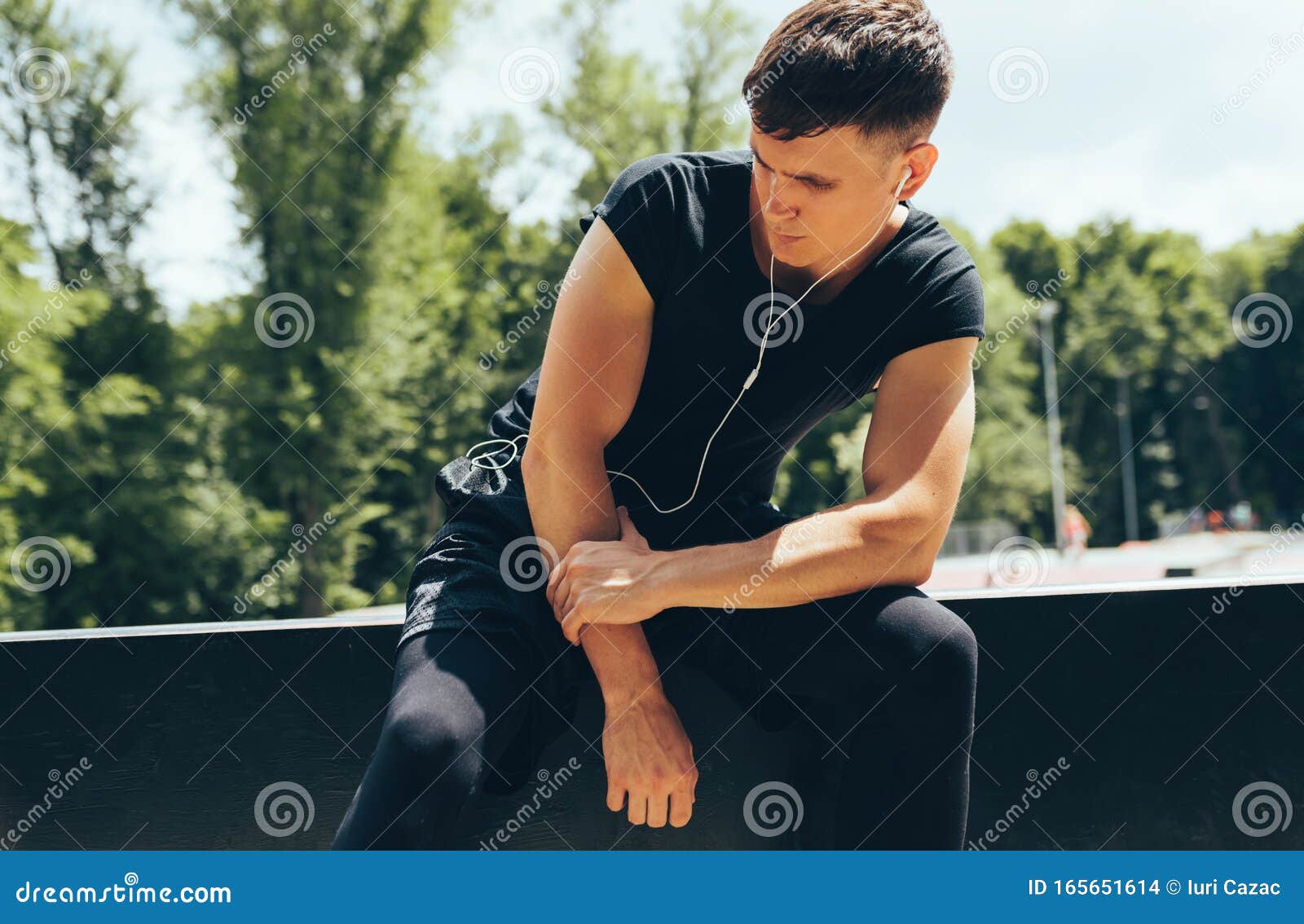 Fitness Man Resting after Running and Exercising, Listening the Music ...