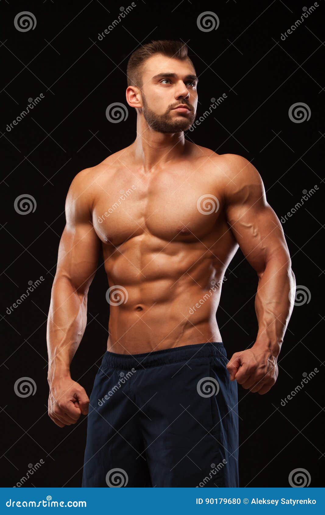 Fitness Muscular Man is Posing and Showing His Torso with Six Pack Abs ...