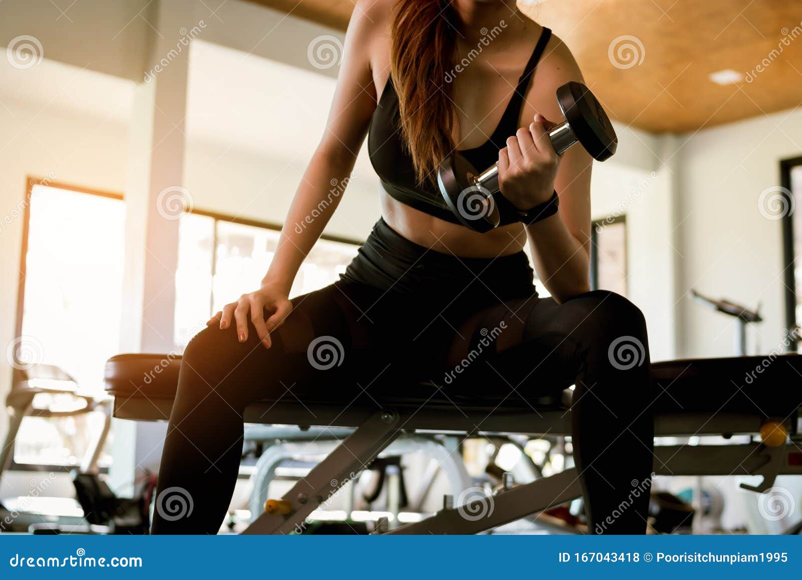 Fitness Woman Doing Exercise Workout Dumbbell At Gym Healthy And