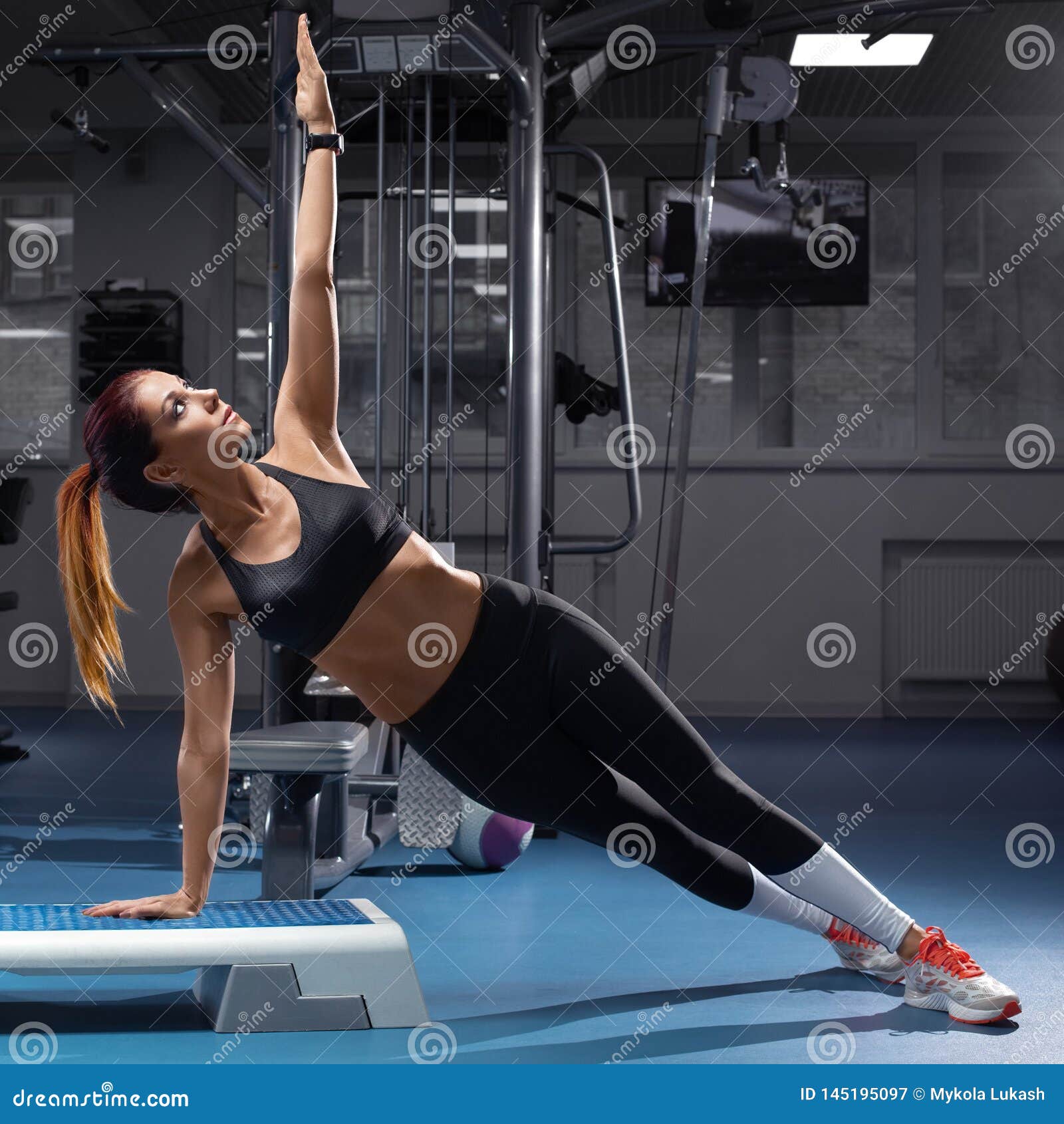 fitness woman doing planking exercise at the gym, sporty girl workout